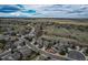 Aerial view of the residential neighborhood and open space, with a winding street at 1563 Baguette Dr, Castle Rock, CO 80108