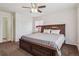 Comfortable bedroom with closet, a large bed, and neutral color scheme at 1563 Baguette Dr, Castle Rock, CO 80108