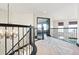 Upper hallway boasts ornate railings and a view into the living room at 1563 Baguette Dr, Castle Rock, CO 80108