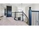 View of the upper hallway with dark railings looking down to the main level of the home at 1563 Baguette Dr, Castle Rock, CO 80108