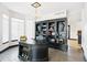 Home office featuring a custom desk, built-in bookshelves, and elegant lighting fixtures at 1563 Baguette Dr, Castle Rock, CO 80108