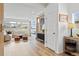 Modern entryway with wood panels, a console table, and an open living area at 4408 Riviera Ct, Aurora, CO 80019