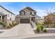 Beautiful two-story home with a stone and brown wood exterior and well-manicured front yard at 4408 Riviera Ct, Aurora, CO 80019
