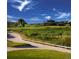 Scenic golf course view with rolling green hills and inviting clubhouse, a golfer's paradise at 4408 Riviera Ct, Aurora, CO 80019