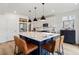 Kitchen island features bar seating, a white countertop and stainless steel appliances at 4408 Riviera Ct, Aurora, CO 80019