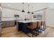 Modern kitchen with a large island, stainless steel appliances, and sleek countertops at 4408 Riviera Ct, Aurora, CO 80019