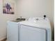 Laundry room features washer and dryer at 4408 Riviera Ct, Aurora, CO 80019