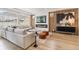 Cozy living room with a modern fireplace, sleek furniture, and stylish accent wall at 4408 Riviera Ct, Aurora, CO 80019