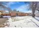 Large backyard with snow-covered grass and detached shed at 7505 Clay St, Westminster, CO 80030