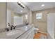 Bathroom with double vanity, granite countertop, and a toilet at 7505 Clay St, Westminster, CO 80030