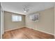 Bright bedroom featuring hardwood floors and a ceiling fan at 7505 Clay St, Westminster, CO 80030