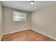 Simple bedroom with hardwood floors and a window at 7505 Clay St, Westminster, CO 80030