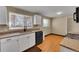 Modern kitchen with white cabinets, granite countertops, and new appliances at 7505 Clay St, Westminster, CO 80030
