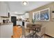 Modern kitchen featuring white cabinets and wood flooring at 7505 Clay St, Westminster, CO 80030