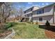 Expansive backyard featuring a lush lawn, manicured landscaping, and inviting patio area at 1479 S Jasper St, Aurora, CO 80017
