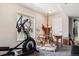A workout area with exercise equipment, an art easel, and a window at 1479 S Jasper St, Aurora, CO 80017