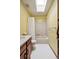 Bright bathroom featuring a skylight and a classic white tub-shower combination at 1479 S Jasper St, Aurora, CO 80017