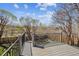 Outdoor deck offering expansive views of the backyard and surrounding landscape under a partly cloudy sky at 1479 S Jasper St, Aurora, CO 80017