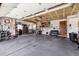 Spacious garage with ample storage, workbench, and decor for the automobile enthusiast at 1479 S Jasper St, Aurora, CO 80017