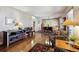 Spacious living room with hardwood floors flowing into the dining area, perfect for entertaining at 1479 S Jasper St, Aurora, CO 80017