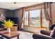 Comfortable living room boasts natural light, large windows, and a cozy atmosphere at 1479 S Jasper St, Aurora, CO 80017