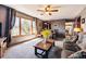 Inviting living room with ample natural light, plush seating, ceiling fan, and a large window with views at 1479 S Jasper St, Aurora, CO 80017