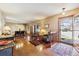 Open-concept living and dining area with gleaming hardwood floors and natural light at 1479 S Jasper St, Aurora, CO 80017