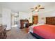 Spacious main bedroom featuring a ceiling fan, ensuite bathroom, and lots of natural light at 1479 S Jasper St, Aurora, CO 80017