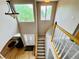 Grand two-story foyer featuring hardwood floors, staircase, and natural light from above at 6188 Viewpoint Ave, Firestone, CO 80504