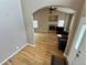 Spacious living room with hardwood floors, fireplace, and open layout, perfect for entertaining at 6188 Viewpoint Ave, Firestone, CO 80504