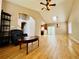 Spacious living room featuring hardwood floors and vaulted ceilings with lots of natural light at 6188 Viewpoint Ave, Firestone, CO 80504