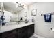 Bathroom featuring a sleek vanity and modern fixtures at 10601 W 78Th Ave, Arvada, CO 80005