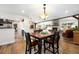 Open concept dining area with views of the living room and kitchen at 10601 W 78Th Ave, Arvada, CO 80005