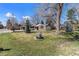 Charming home with a well-manicured front yard and mature trees at 10601 W 78Th Ave, Arvada, CO 80005