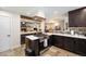 Modern kitchen with stainless steel appliances and a center island at 10601 W 78Th Ave, Arvada, CO 80005
