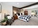 Comfortable bedroom with wood accent wall and patio access at 10601 W 78Th Ave, Arvada, CO 80005