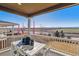 Covered patio with scenic view and outdoor furniture at 1805 Papuan Ct, Brighton, CO 80601