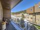 Modern balcony overlooking neighborhood, trees and mountains at 28665 Tepees Way, Evergreen, CO 80439