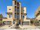 Striking contemporary home featuring a unique facade, multiple balconies, and a two-car garage at 28665 Tepees Way, Evergreen, CO 80439