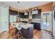 Well-appointed kitchen with stainless steel appliances, a center island, and stylish pendant lighting at 28665 Tepees Way, Evergreen, CO 80439