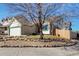 This house features a well-manicured front yard, a charming exterior, and a two-car garage at 12251 Niagara Ct, Brighton, CO 80602