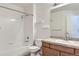 Clean bathroom with shower/tub combo and wood vanity at 21123 White Ash Ln, Parker, CO 80138