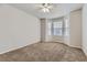 Bright bedroom featuring bay window and neutral carpeting at 21123 White Ash Ln, Parker, CO 80138