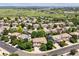 An aerial view of a suburban neighborhood with well-maintained homes and lush green landscaping at 11911 E Lake Cir, Greenwood Village, CO 80111