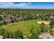 An expansive green space and baseball field nestled within a community, seen from an aerial perspective at 11911 E Lake Cir, Greenwood Village, CO 80111