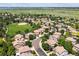 A scenic aerial view of homes nestled among mature trees, with a baseball field adding to the community's charm at 11911 E Lake Cir, Greenwood Village, CO 80111