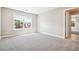 Bright bedroom with large window offering natural light and a neutral color palette at 11911 E Lake Cir, Greenwood Village, CO 80111