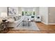 Bright living room featuring a bay window and modern decor with a comfortable sofa and chairs at 11911 E Lake Cir, Greenwood Village, CO 80111