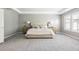 Spacious main bedroom featuring an elegant tray ceiling, large windows, and neutral decor at 11911 E Lake Cir, Greenwood Village, CO 80111