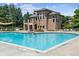 A refreshing in-ground community pool with sun loungers and a seating area perfect for relaxation at 11911 E Lake Cir, Greenwood Village, CO 80111